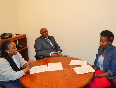 Shose Kombe of KCB Bank, Atty Njoroge Kamau of Boston, U.S and Jennifer Chege of KCB Bank at law offices of Attny Kamau.