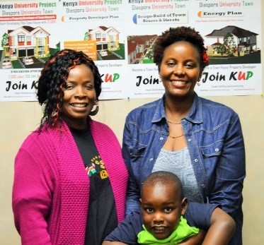 Sheila of Springfield, MA with Jennifer of KCB Bank at Worcester. Sheila Son is held by Jennifer.