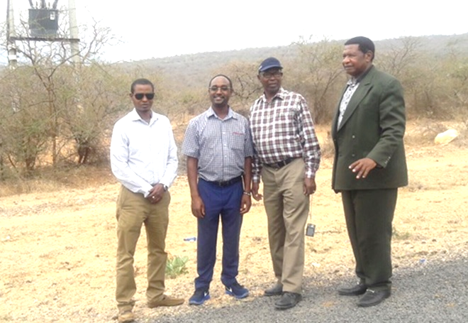 Dr. Mark Kabue, Dr. Philip Mwalali and Bishop Donald Mwawasi at the Diaspora University Town land. 